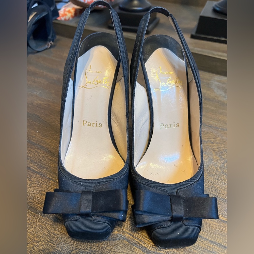 Like new Christian Louboutinsatin heels.